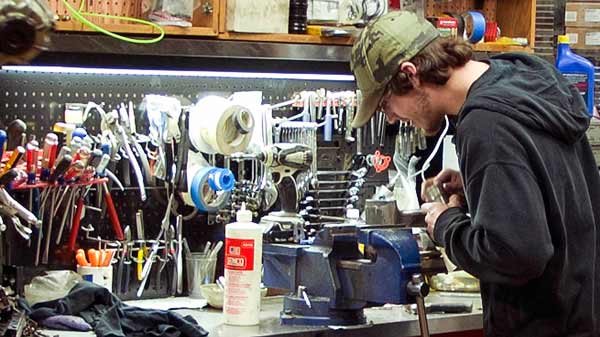 ANCO service technician repairing a tool